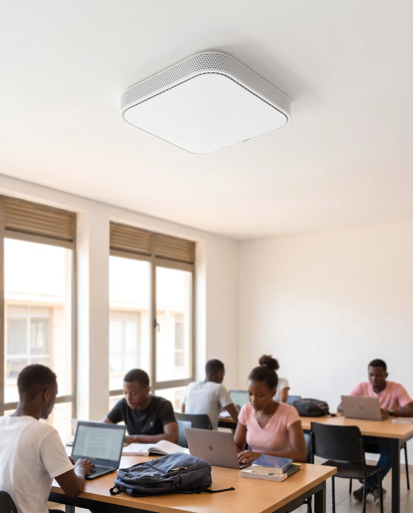 A Infinity Indoor access point on a hostel common room ceiling